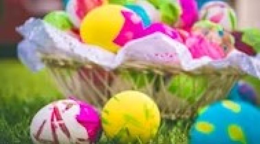 Brightly coloured eggs in a basket