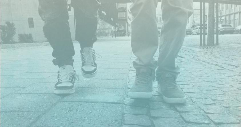 Picture of two people walking down a street