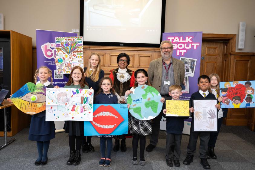The pupils, with their winning posters, are congratulated by the Worshipful Mayor of Barnet, Cllr Nagus Narenthira, and Chris Munday, Executive Director of Children Services