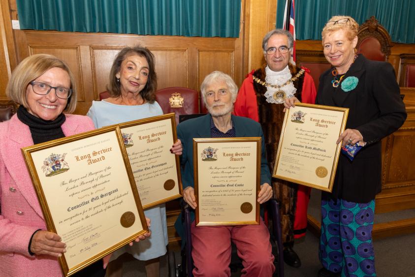 The Worshipful Mayor of Barnet, Councillor Tony Vourou, gives the Councillors their Long Service Awards.