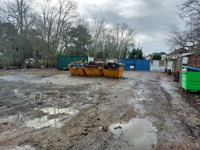 Sopers Yard, 155 Bell Lane, Hendon, was being used for multiple purposes including open-air storage, waste transfer and processing, and a used car sales lot without planning permission.