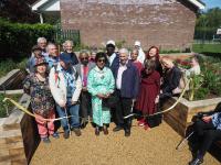 The Worshipful Mayor of Barnet, Cllr Nagus Narenthira, cuts the ribbon to officially open the new sensory garden in Victoria Park, Finchley.