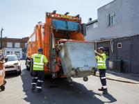 A refuse crew collecting trade waste
